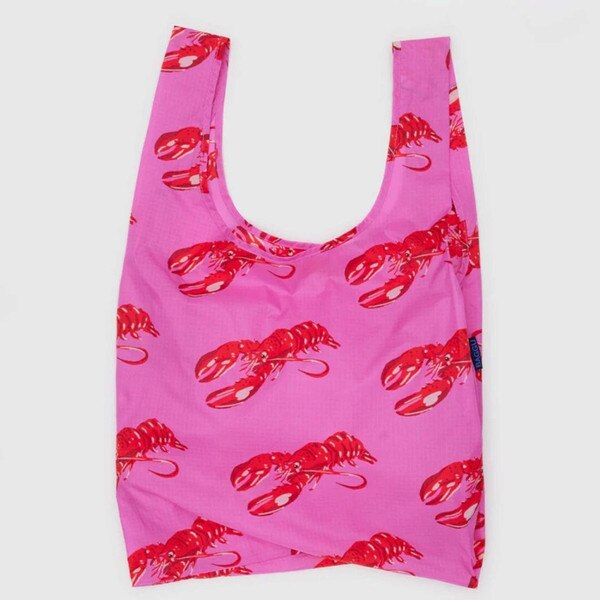 Pink reusable BAGGU bag with allover red lobster print and blue logo tag